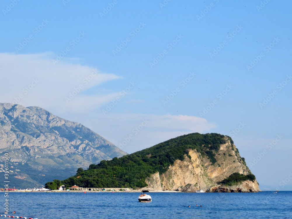Saint Nicholas Island with Hawaii Beach on the Budva Riviera in the Adriatic Sea in the Mediterranean