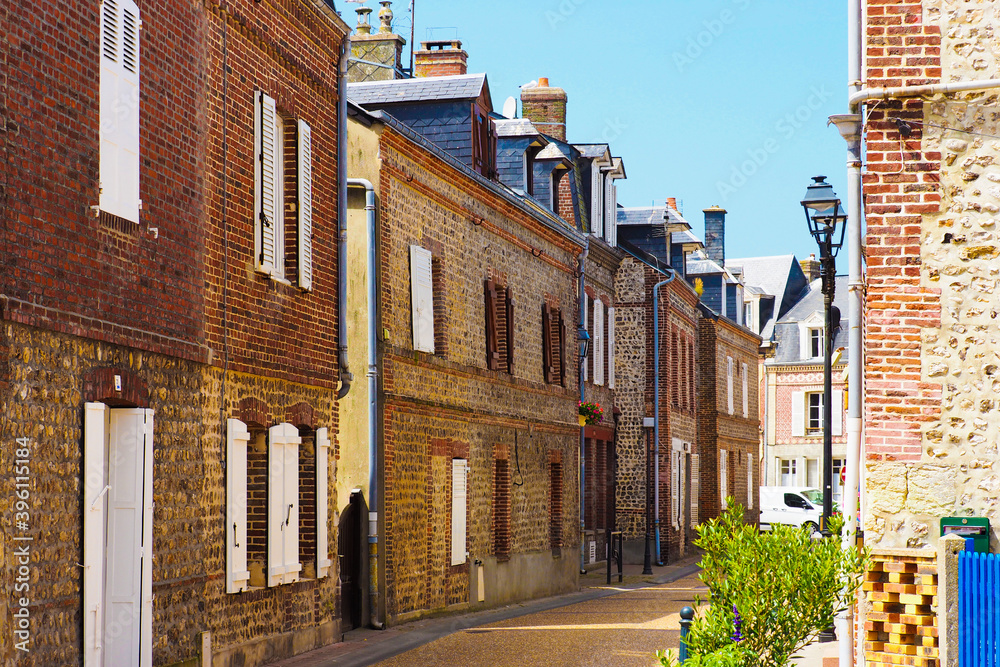 Street of Etretat, Normandy, France. Medieval houses, picturesque landscape of Etretat, view of the ancient city