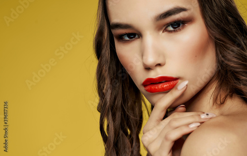 Beautiful woman red lips bared shoulders glamor close-up luxury