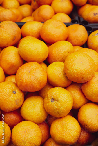 Orange background of ripe mandarins