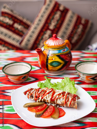  Brizol - a dish of omelet and beef covered with ketchup and mayonnaise in an oriental style photo