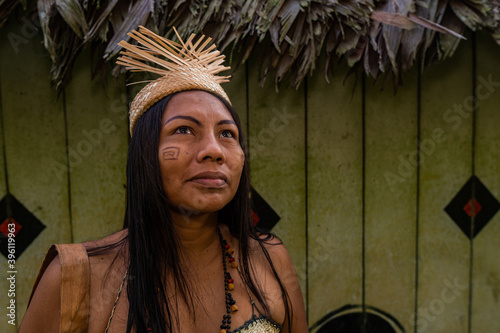 Obraz na płótnie indigenous woman from the Huitoto tribe of the Colombian Amazon with paint on he