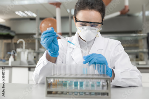 Young female scientist working in laboratory 