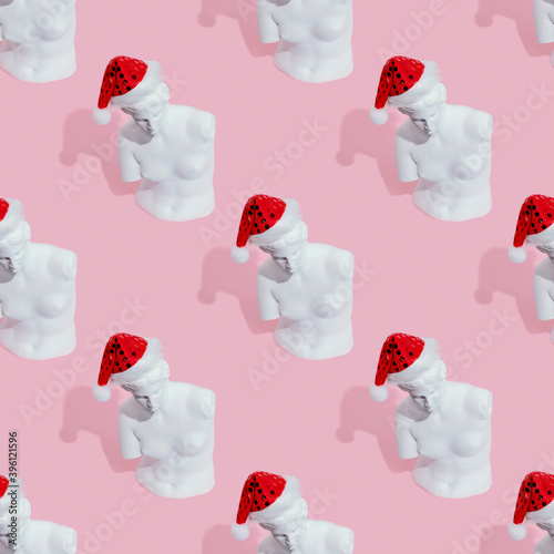 White woman statue on pink background