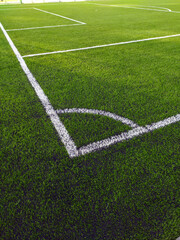 Artificial grass soccer field. Corner kick line of ball and a soccer field , football field , background texture