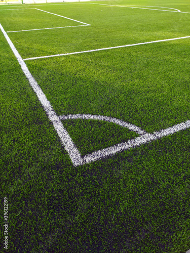 Artificial grass soccer field. Corner kick line of ball and a soccer field , football field , background texture