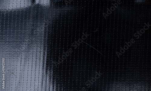 black rubber adhesive tape surface, macro flash photo, dark plastic texture, cool photo overlay.