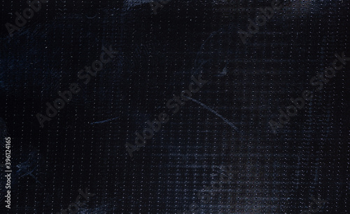 black rubber adhesive tape surface, macro flash photo, dark plastic texture, cool photo overlay.