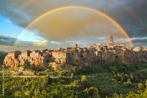 Rainbow over a medieval town of Pitigliano at sunset, Pitigliano, Tuscany, Italy