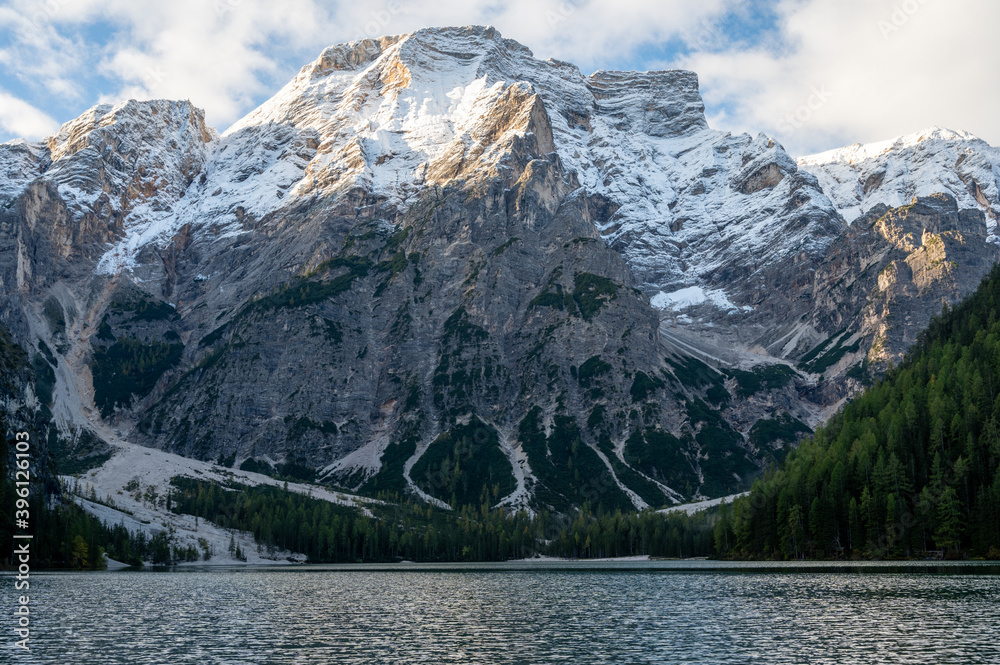 View of Mount Seekofel mirroring in the clear calm water of iconic mountain lake Pragser Wildsee (Lago di Braies) in Italy, Dolomites, Unesco World Heritage, South Tyrol