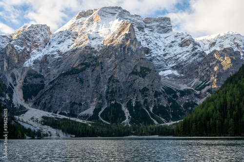 View of Mount Seekofel mirroring in the clear calm water of iconic mountain lake Pragser Wildsee (Lago di Braies) in Italy, Dolomites, Unesco World Heritage, South Tyrol