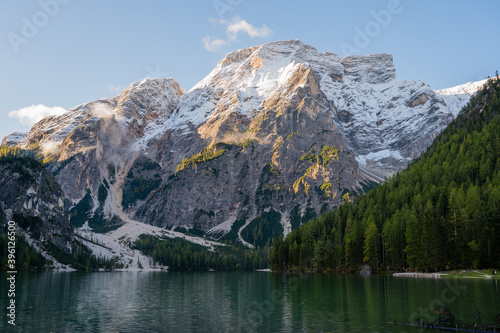 View of Mount Seekofel mirroring in the clear calm water of iconic mountain lake Pragser Wildsee (Lago di Braies) in Italy, Dolomites, Unesco World Heritage, South Tyrol © Alexander