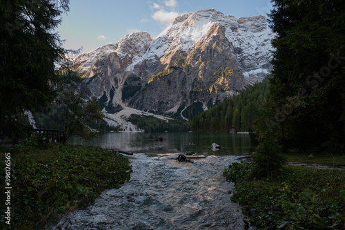 View of Mount Seekofel mirroring in the clear calm water of iconic mountain lake Pragser Wildsee (Lago di Braies) in Italy, Dolomites, Unesco World Heritage, South Tyrol