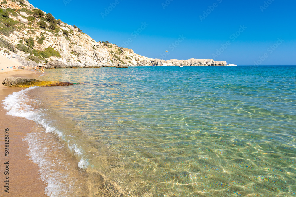 crystal clear water on Tsambika beach in Rhodes island Greece