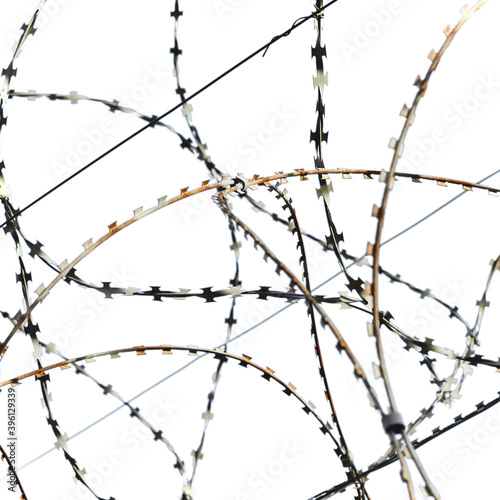 Barbed wire over the fence on a white background, isolated