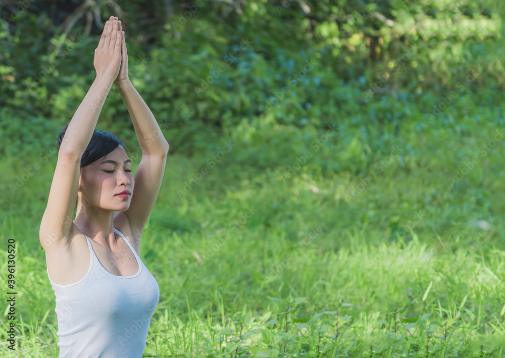 Young women Sitting doing yoga to relax . practice meditation to care wellness outdoor Young women Sitting doing yoga to relax . practice meditation to care wellness outdoor