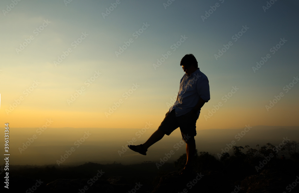 a man on a mountain top. Person on the rock. Sport and active life concept. Beauty world.