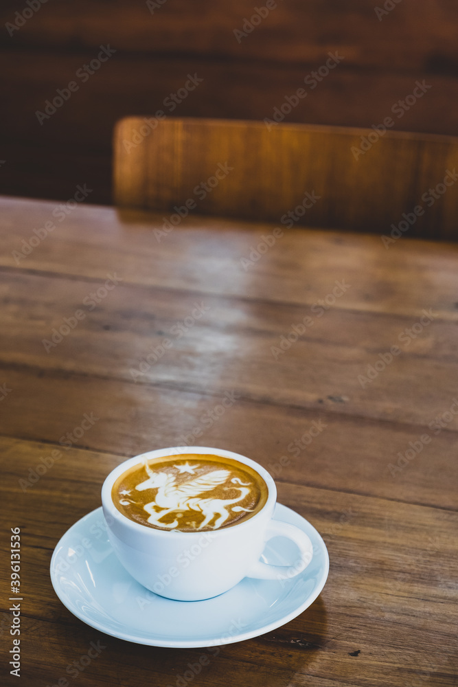 Obraz premium A cup of cappucino on a wood background