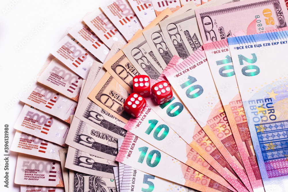 American dollars, euros, rubles, and dice on top. Gambling. American dollars, euros, rubles, and dice on top. Gambling.