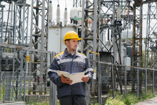 The energy engineer inspects the equipment of the substation. Power engineering. Industry