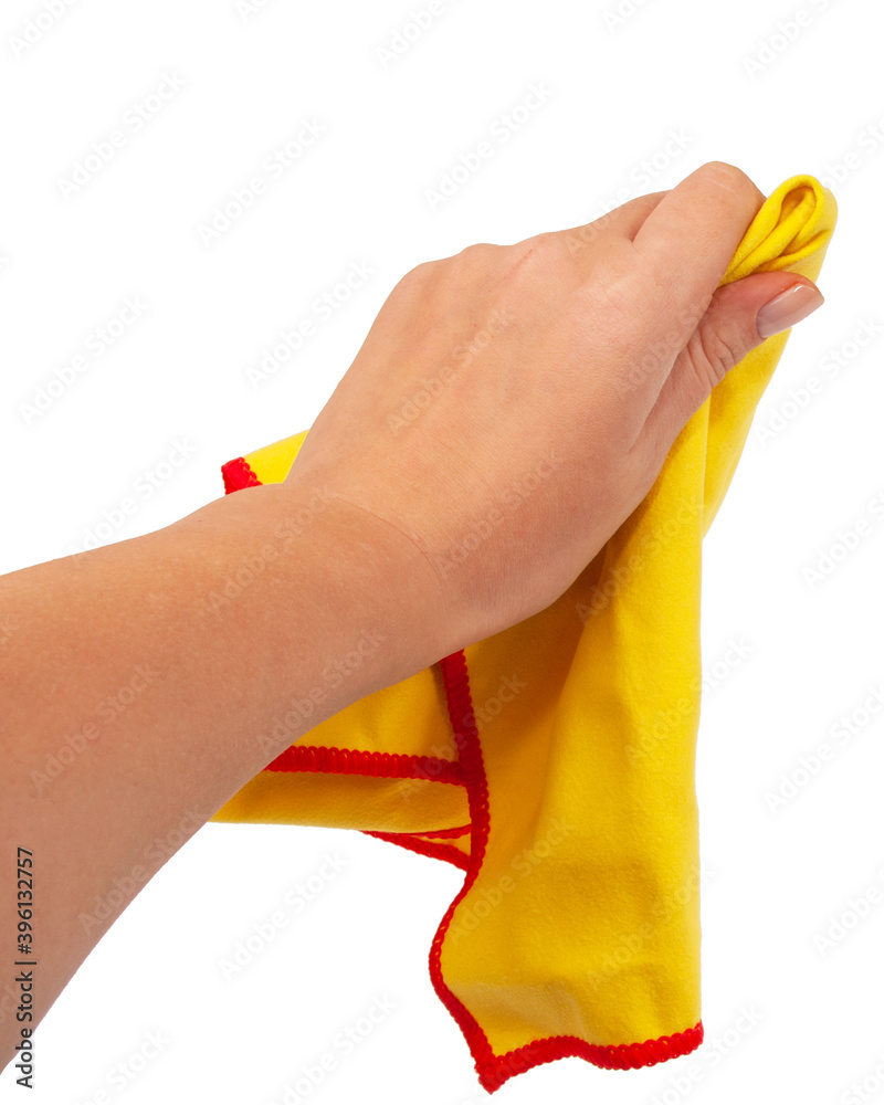 Yellow cleaning rag in hand isolated on the white Yellow cleaning rag in hand isolated on the white