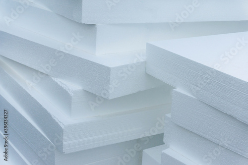 Expanded polystyrene plates. A stack of building materials for house insulation. Close-up photo