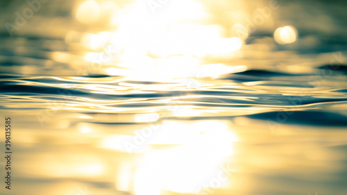Light reflections in the rippled water surface