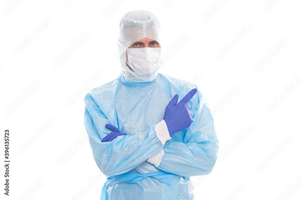 man doctor epidemiologist wearing respirator mask and safety protective costume pointing finger in gloves on isolated white background, copy space, covid 19 sars