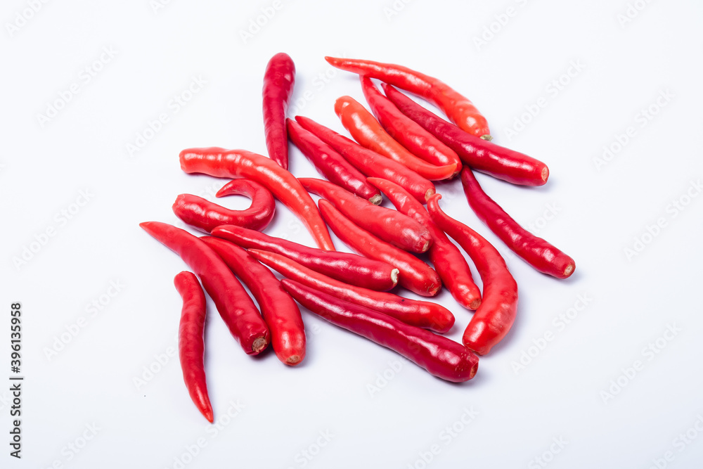 A group of red chili without a stalk. Isolated on white background A group of red chili without a stalk. Isolated on white background