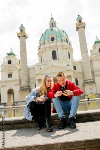 Young couple using mobile phone in Vienna, Austria