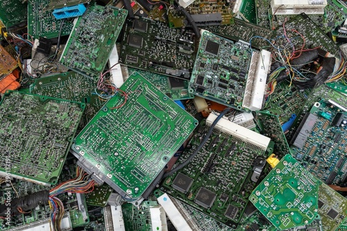 Scrap yard printed circuit board electronic waste for recycling with selective focus. main board electronic waste