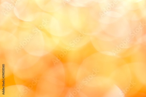  Sunny light blurred background. Many translucent large bokeh circles in yellow, orange and white.