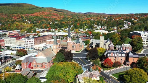 Aerial View of Downtown North Adams, Massachusetts USA. First Baptist Church and Public Library on Sunny Autumn Day, Orbit Drone Shot photo