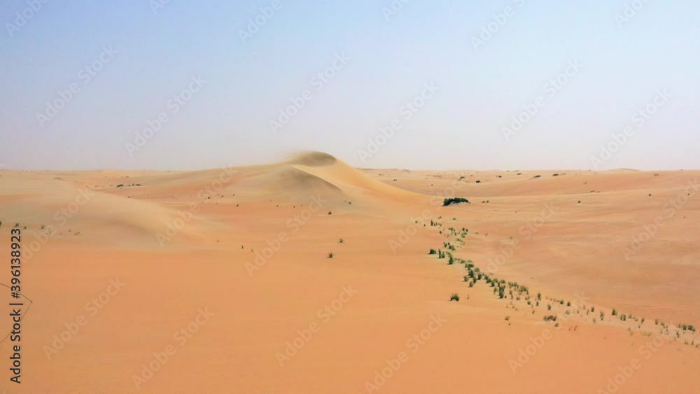 Aerial view of a 4x4 truck, driving on the Arabian Desert, sunny day, in Saudi Arabia - dolly, drone shot Aerial view of a 4x4 truck, driving on the Arabian Desert, sunny day, in Saudi Arabia - dolly, drone shot