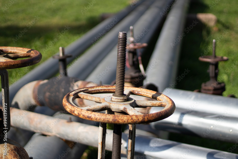 Rusty valve to shut off water pipes. Factory communications. Metal parts of the pipeline. Rusty valve to shut off water pipes. Factory communications. Metal parts of the pipeline.