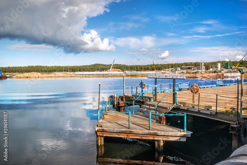 Fototapeta Naklejka Na Ścianę i Meble -  Tamarin pier for ships on the Solovetsky Islands. Caption: Tamarin pier