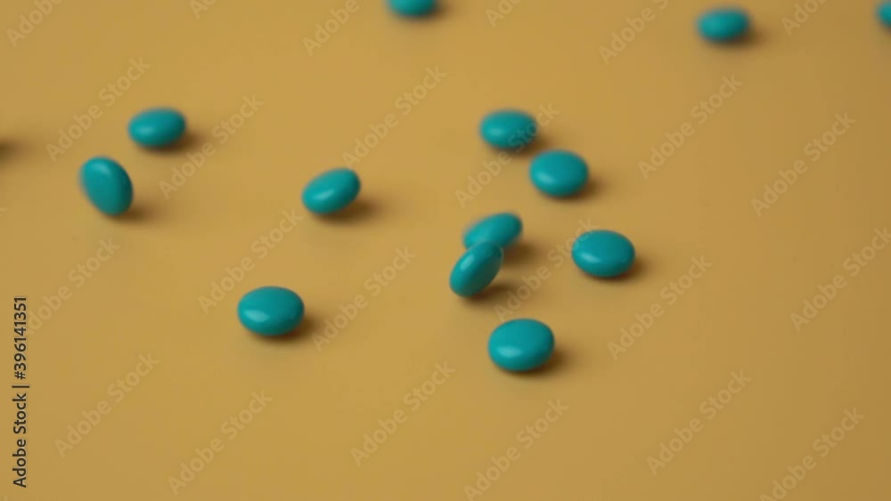 blue pills falling with slow motion blue pills falling with slow motion