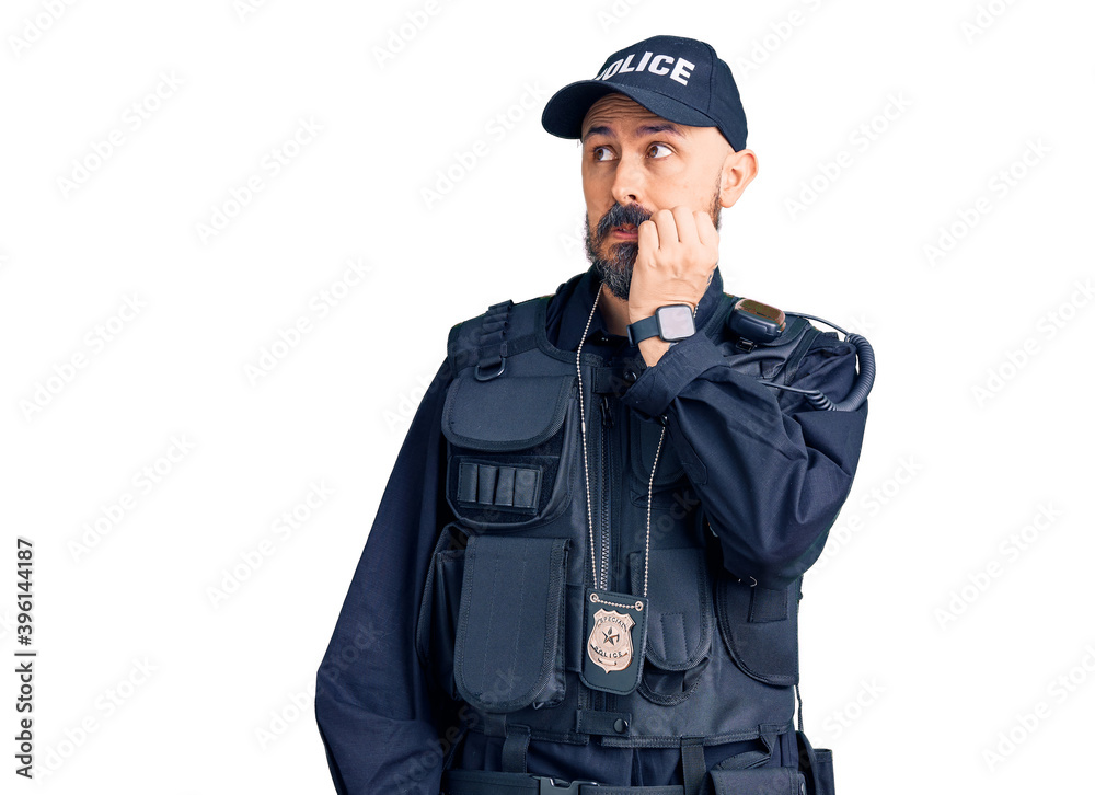Young handsome man wearing police uniform looking stressed and nervous with hands on mouth biting nails. anxiety problem.