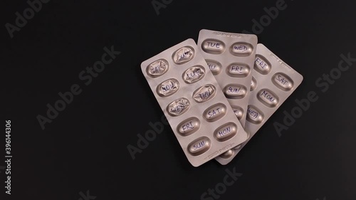 Pills in blister with hand written days of the week on each cell.Organizer concept.