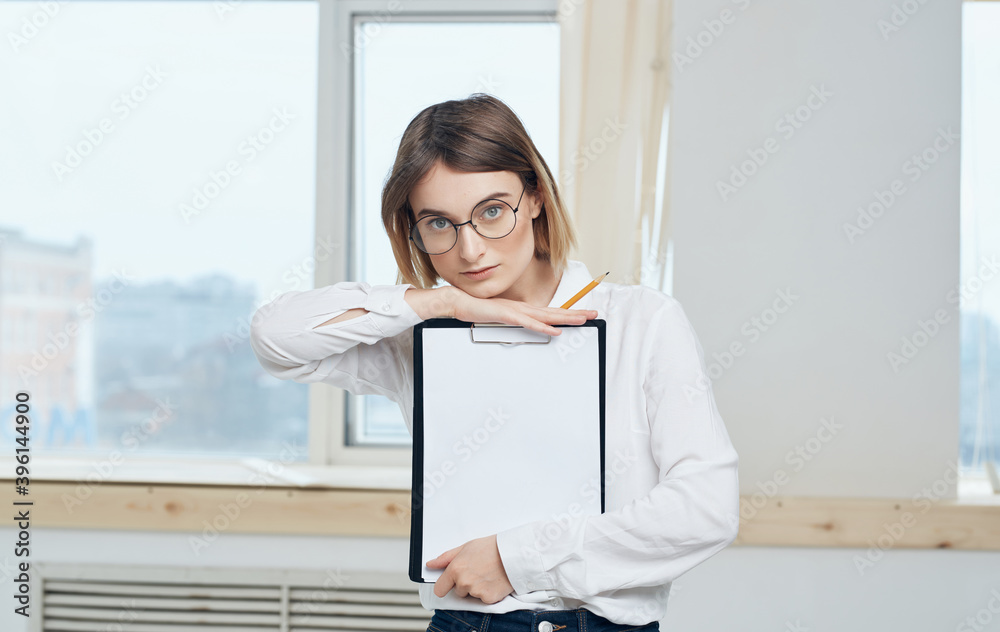 Naklejka premium Business woman white shirt documents office near the window