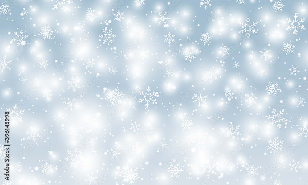 Snow background. Winter snowfall. White snowflakes on blue sky. Christmas background. Falling snow.