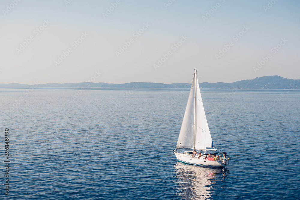 Beautiful holidays on a sailboat with morning calm sea.