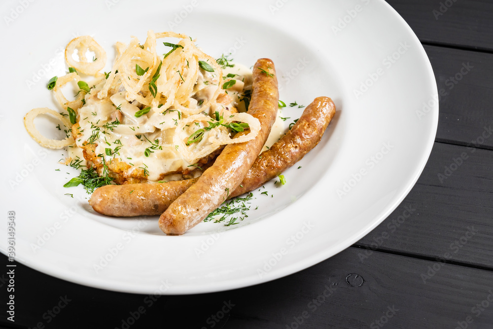 potato pancakes with sausages and fried onion potato pancakes with sausages and fried onion