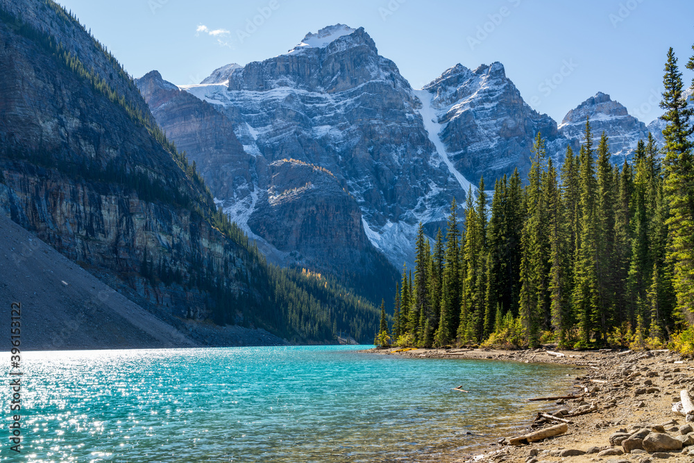 Moraine lake beautiful landscape in summer sunny day morning. Sparkle turquoise blue water, snow-covered Valley of the Ten Peaks. Banff National Park, Canadian Rockies, Alberta, Canada
