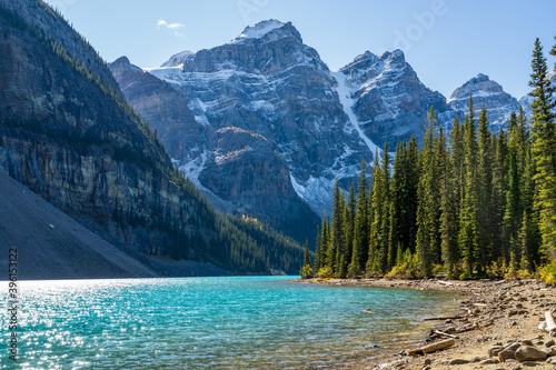 Moraine lake beautiful landscape in summer sunny day morning. Sparkle turquoise blue water, snow-covered Valley of the Ten Peaks. Banff National Park, Canadian Rockies, Alberta, Canada