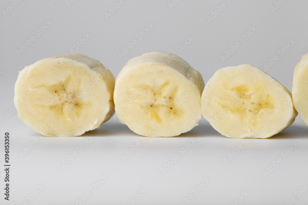 Sliced banana slices on a white background close-up Sliced banana slices on a white background close-up