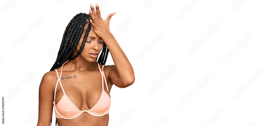 Beautiful hispanic woman wearing bikini surprised with hand on head for mistake, remember error. forgot, bad memory concept. Beautiful hispanic woman wearing bikini surprised with hand on head for mistake, remember error. forgot, bad memory concept.