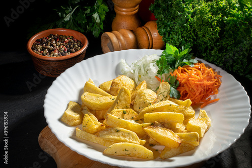 Baked potat and vegetables on dark background photo