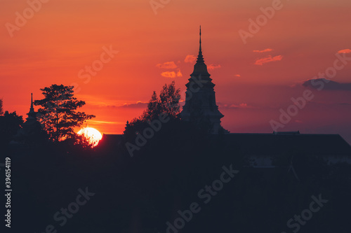 View over the temples of Chaiyaphum in Thailand to the surrounding mountains at sunset © nukul2533