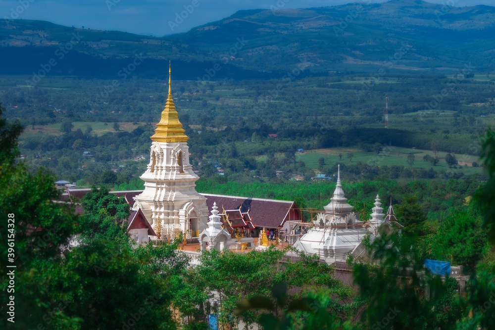 Chaiyaphum Temple set amid green mountains with sunset sky,Place for religious practices of Thailand